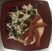 #whatsforbreakfast Butter Scrambled Eggs with Bacon and Provolone on a half Tumaro’s Low Carb Multi-Grain Tortilla, served with a Kale Slaw, Blueberry, and Cashew Salad