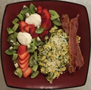 #whatsforbreakfast Spinach and Onion, Butter Scrambled Eggs with Parmesan, Nitrate-Free Thickcut Bacon, Vanilla Cheesecake Fat Bombs with Strawberry and Kiwi