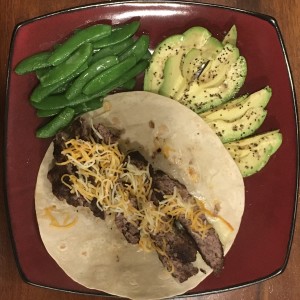 <a class="bx-tag" rel="tag" href="https://streetloc.com/view-channel-profile/whatsfordinner"><s>#</s><b>whatsfordinner</b></a> Iron Skillet Butter Grilled Steak Burger with 4-Cheese Shred (and Muenster underneath) on a Tumaro’s Carb Wise Wrap (w/ Dijon Mustard [not pictured]), Steamed and Buttered Sugar Snaps, and Avocado  