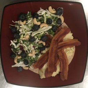 <a class="bx-tag" rel="tag" href="https://streetloc.com/view-channel-profile/whatsforbreakfast"><s>#</s><b>whatsforbreakfast</b></a> Butter Scrambled Eggs with Bacon and Provolone on a half Tumaro’s Low Carb Multi-Grain Tortilla, served with a Kale Slaw, Blueberry, and Cashew Salad